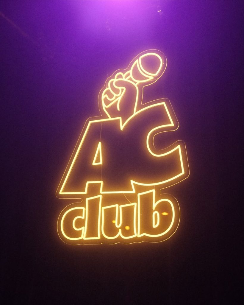 neon AC club stand up warm white comedy club